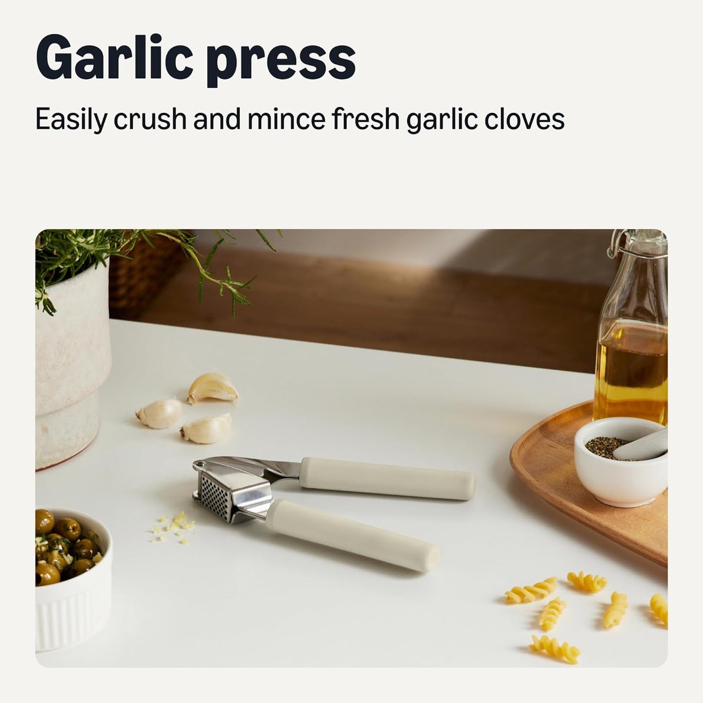 Amazon Basics Garlic Press, Stainless Steel, Soft Grip Handle, Dishwasher-Safe, Linen Gray
